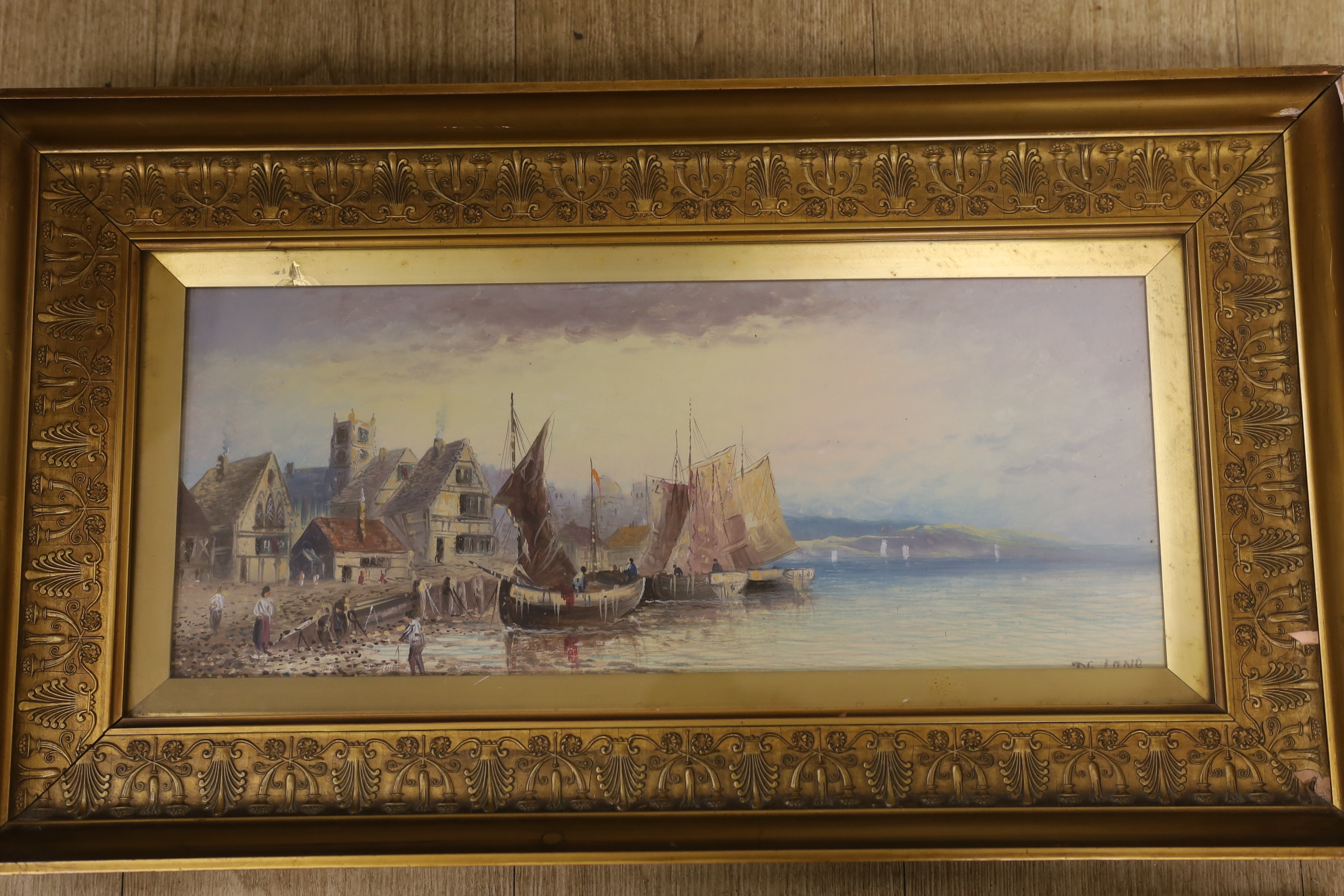 19th century, Continental School, pair of oils on board, Coastal scenes with moored fishing boats, one indistinctly signed, partially obscured by the mount, 18 x 46cm, ornate gilt framed
